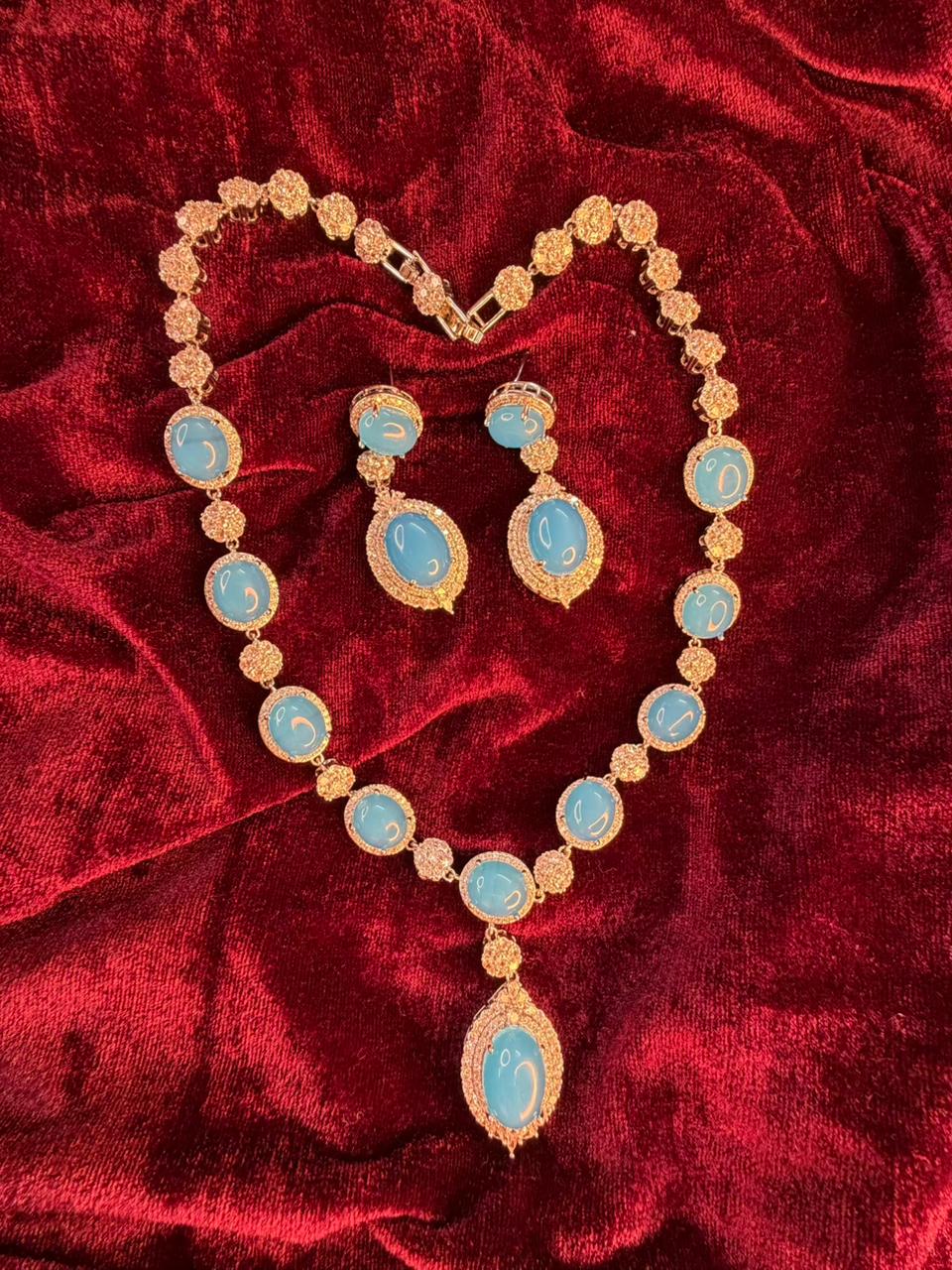 Oval Halo Design Rhodium-Plated Necklace Set with Turquoise Blue Stones