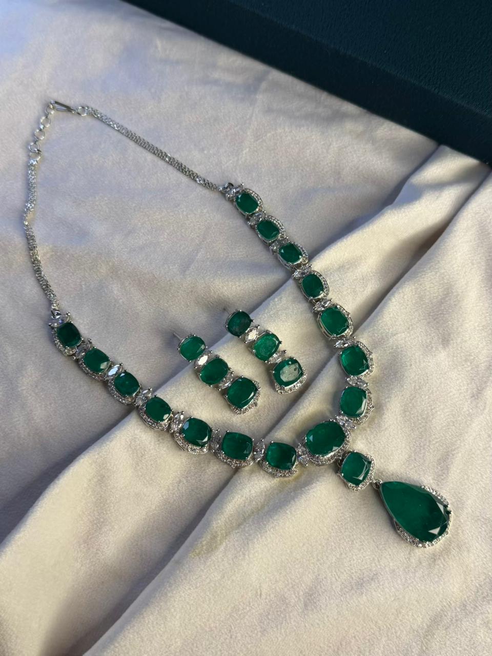 Emerald Green Luxury Studded Necklace and Studs Sets in Rhodium Gold Plating