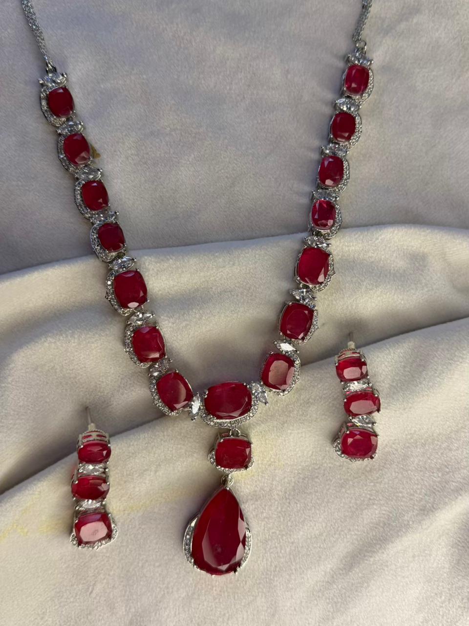 Ruby Red Luxury Studded Necklace and Studs Sets in Rhodium Silver Plating