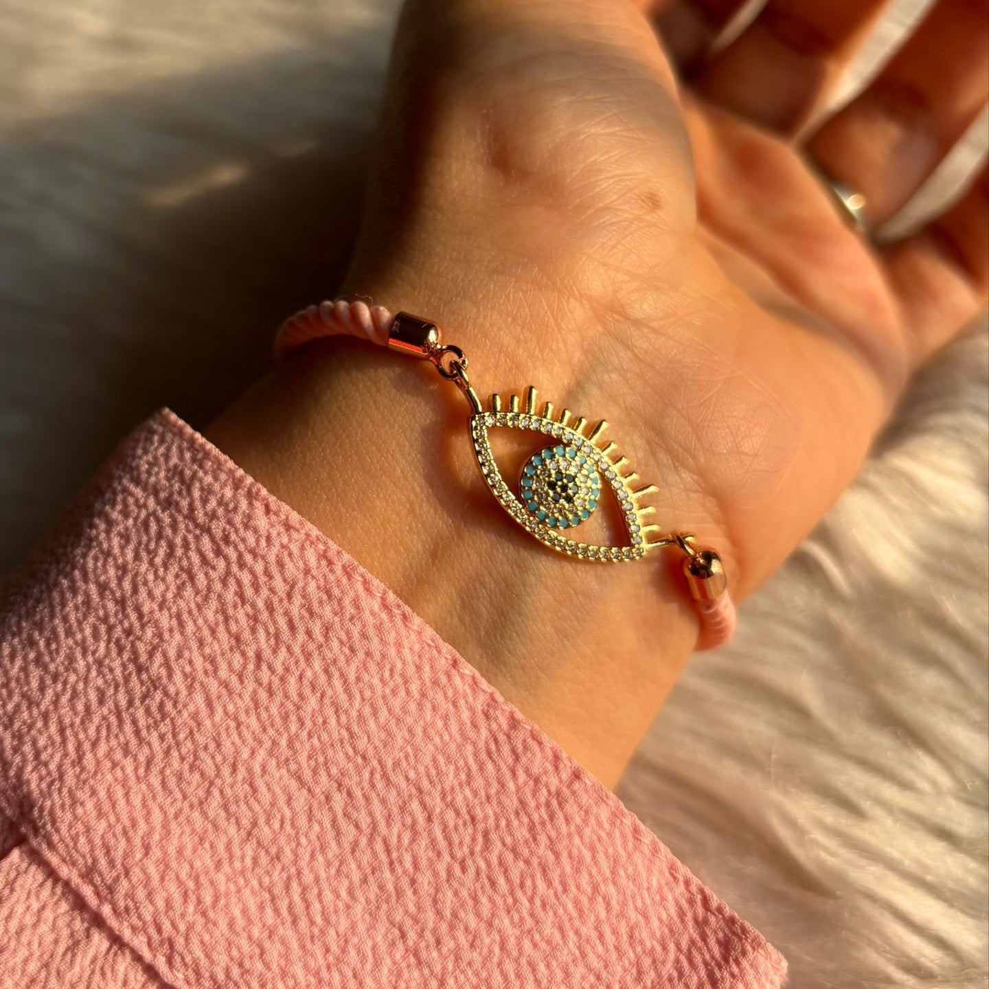 Golden Eyelashes Evil Eye Bracelet in Pink Band