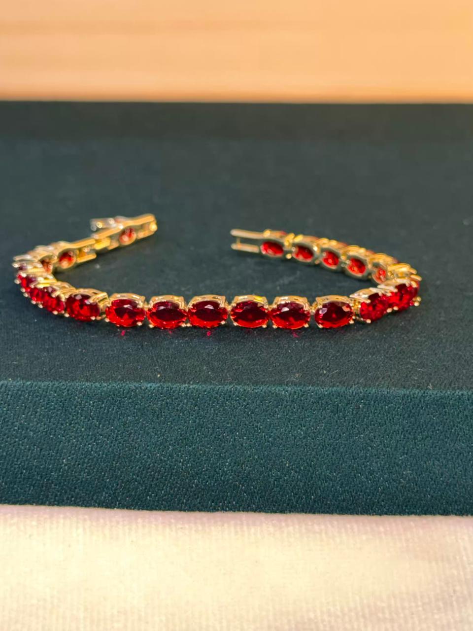 Ruby Red Oval Shaped Gold Plated Tennis Bracelet