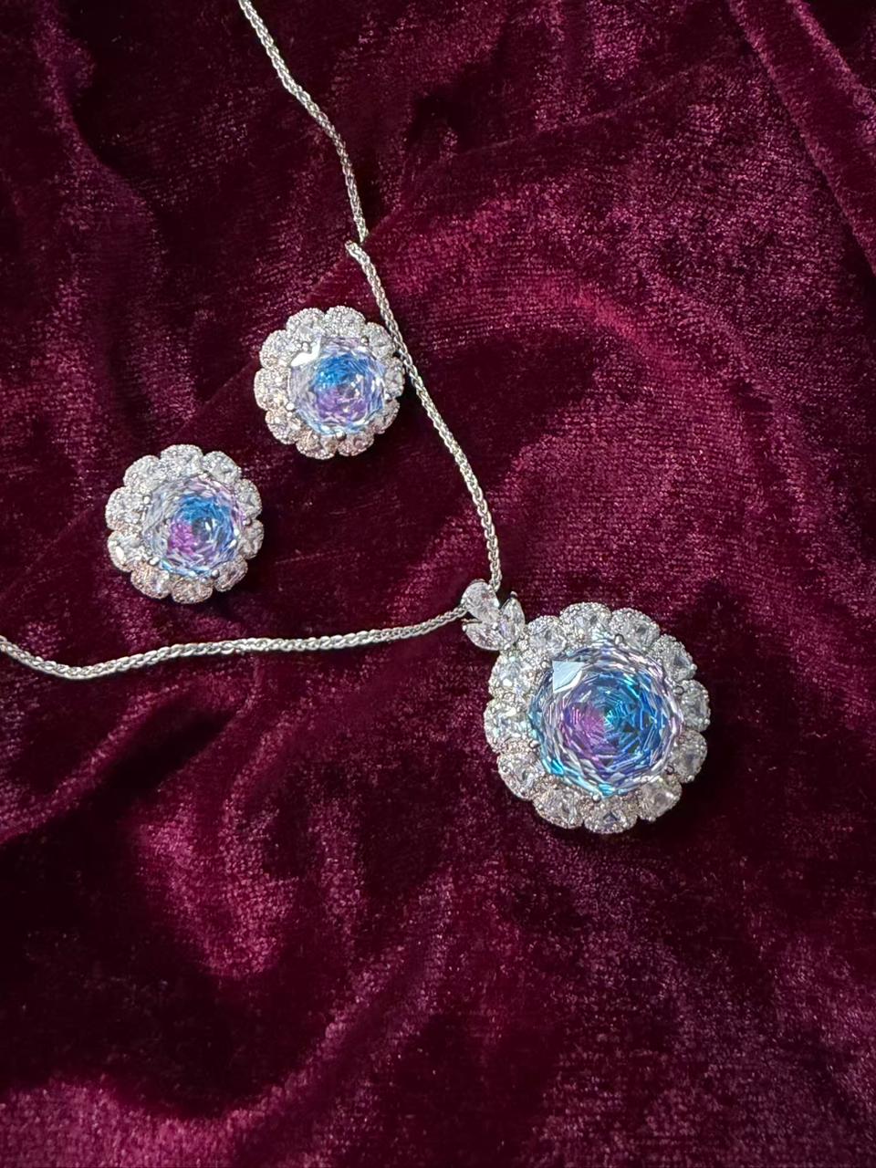 Round Floral Halo Rhodium-Plated Silver Necklace Set with Iridescent Blue Stones