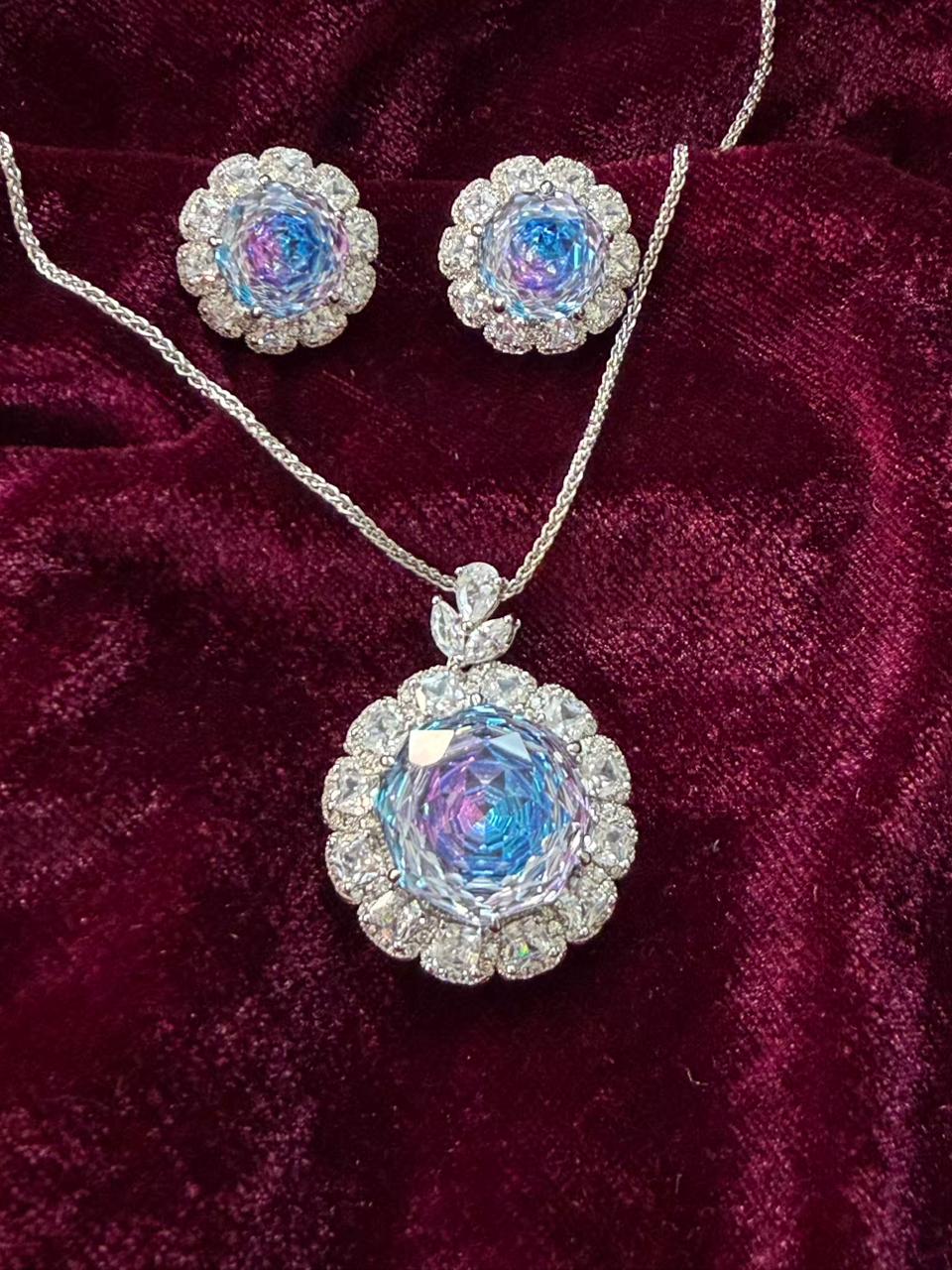 Round Floral Halo Rhodium-Plated Silver Necklace Set with Iridescent Blue Stones
