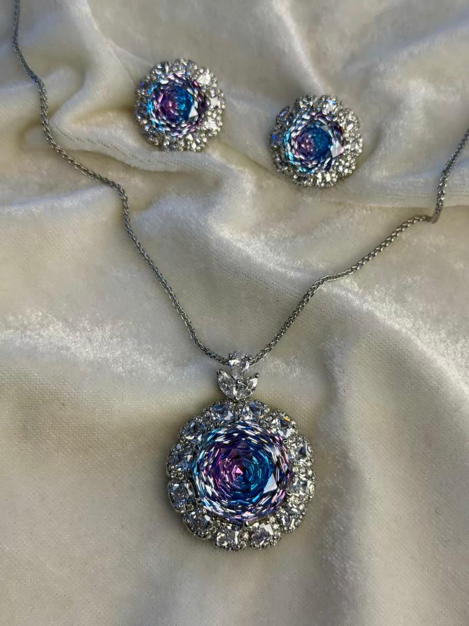 Round Floral Halo Rhodium-Plated Silver Necklace Set with Iridescent Blue Stones