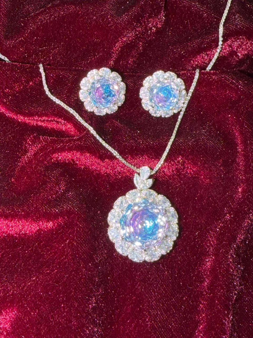 Round Floral Halo Rhodium-Plated Silver Necklace Set with Iridescent Blue Stones