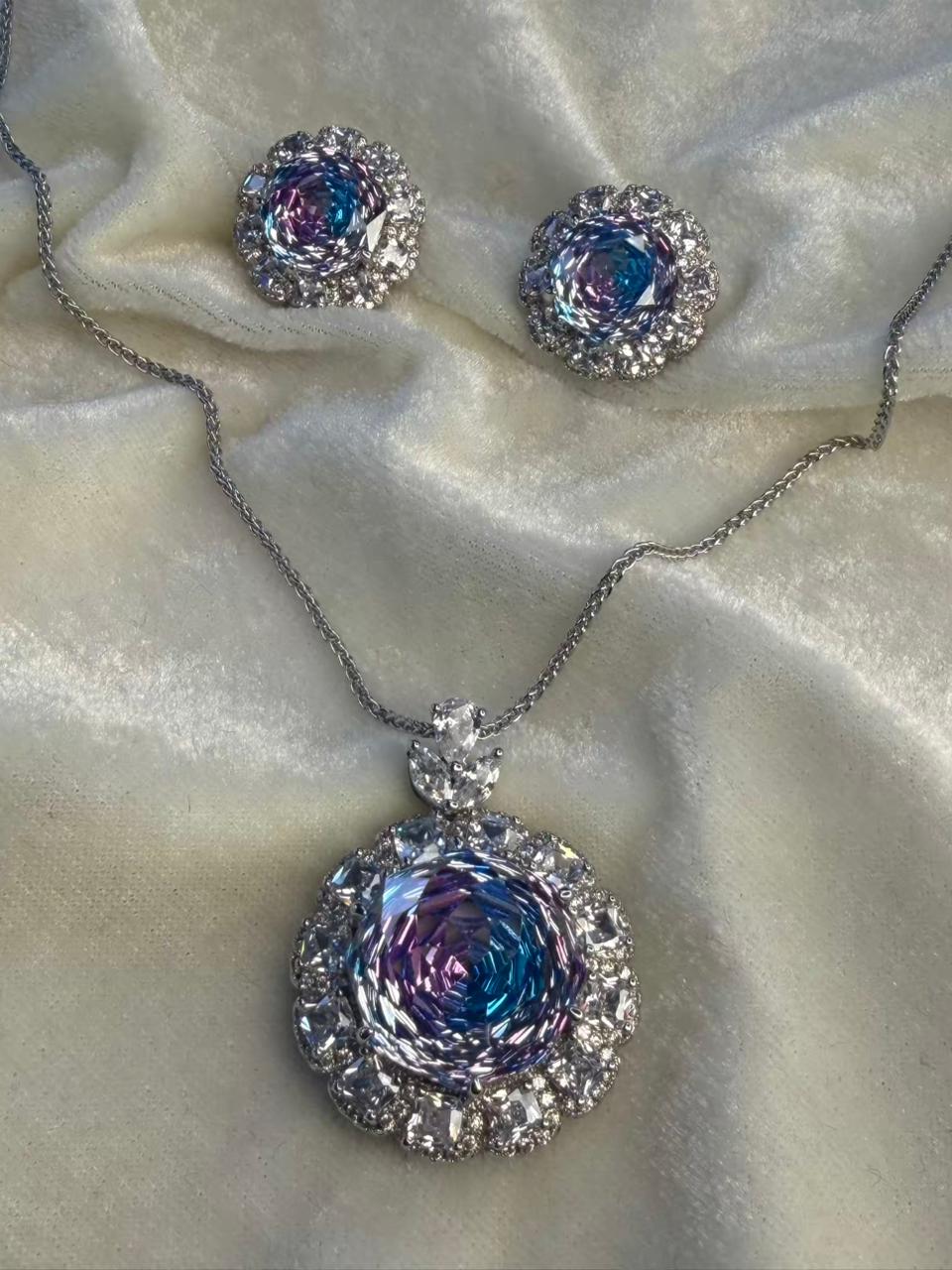 Round Floral Halo Rhodium-Plated Silver Necklace Set with Iridescent Blue Stones