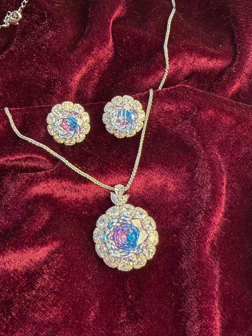 Round Floral Halo Rhodium-Plated Silver Necklace Set with Iridescent Blue Stones