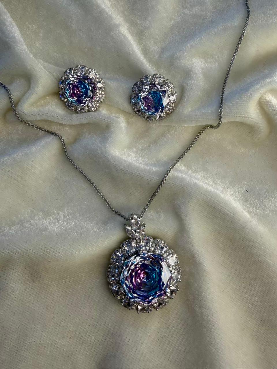 Round Floral Halo Rhodium-Plated Silver Necklace Set with Iridescent Blue Stones