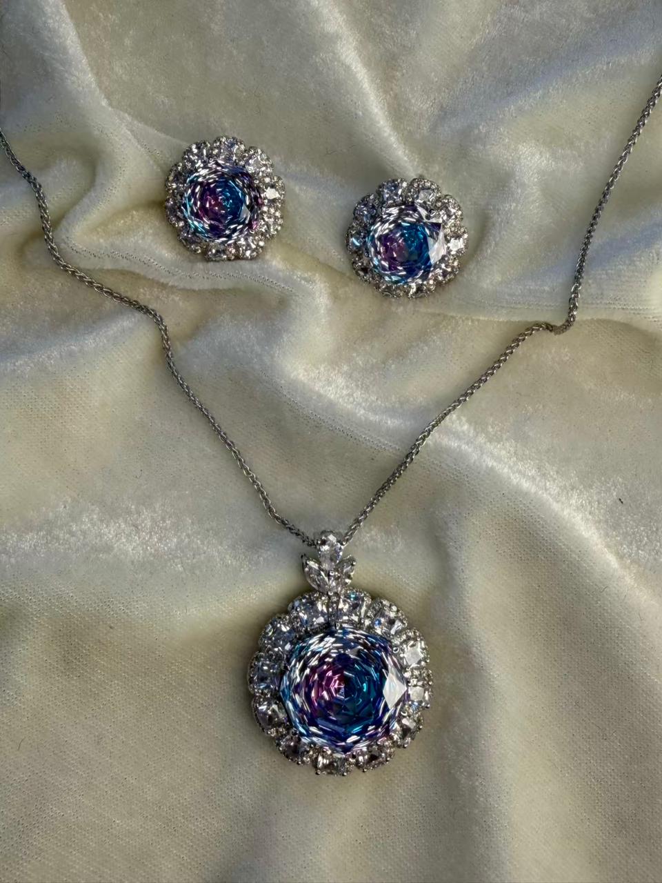 Round Floral Halo Rhodium-Plated Silver Necklace Set with Iridescent Blue Stones