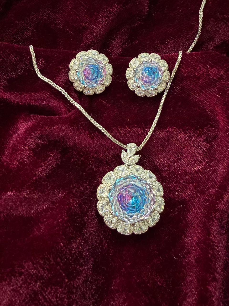 Round Floral Halo Rhodium-Plated Silver Necklace Set with Iridescent Blue Stones