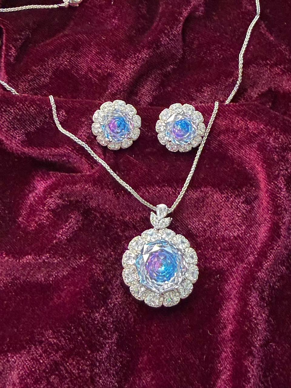 Round Floral Halo Rhodium-Plated Silver Necklace Set with Iridescent Blue Stones