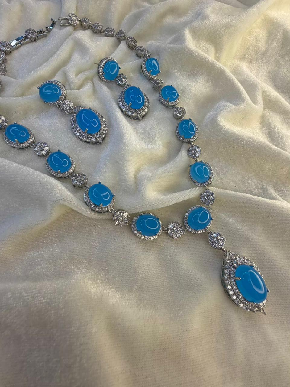 Oval Halo Design Rhodium-Plated Necklace Set with Turquoise Blue Stones