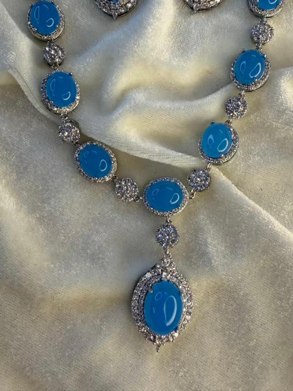 Oval Halo Design Rhodium-Plated Necklace Set with Turquoise Blue Stones