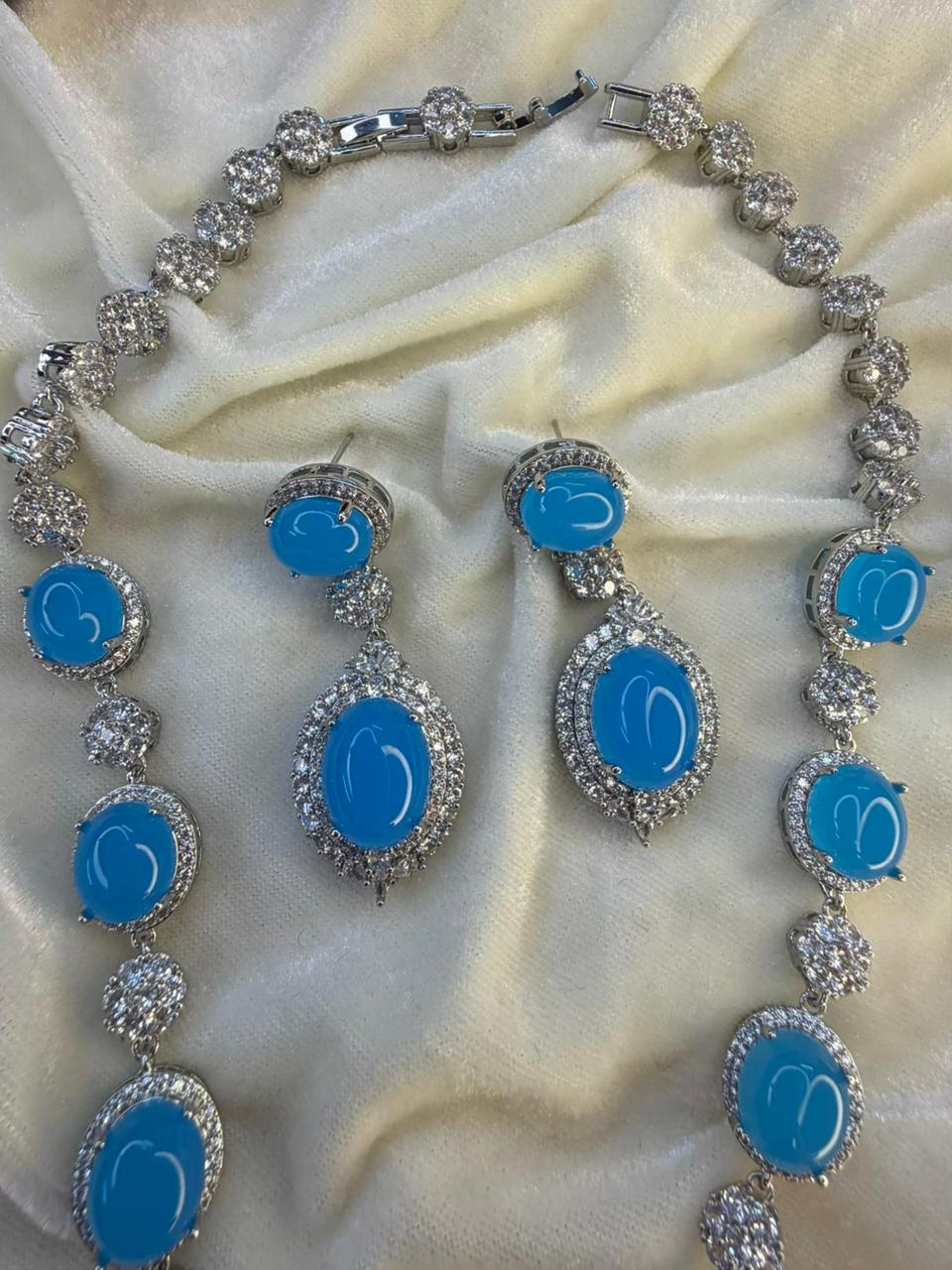 Oval Halo Design Rhodium-Plated Necklace Set with Turquoise Blue Stones