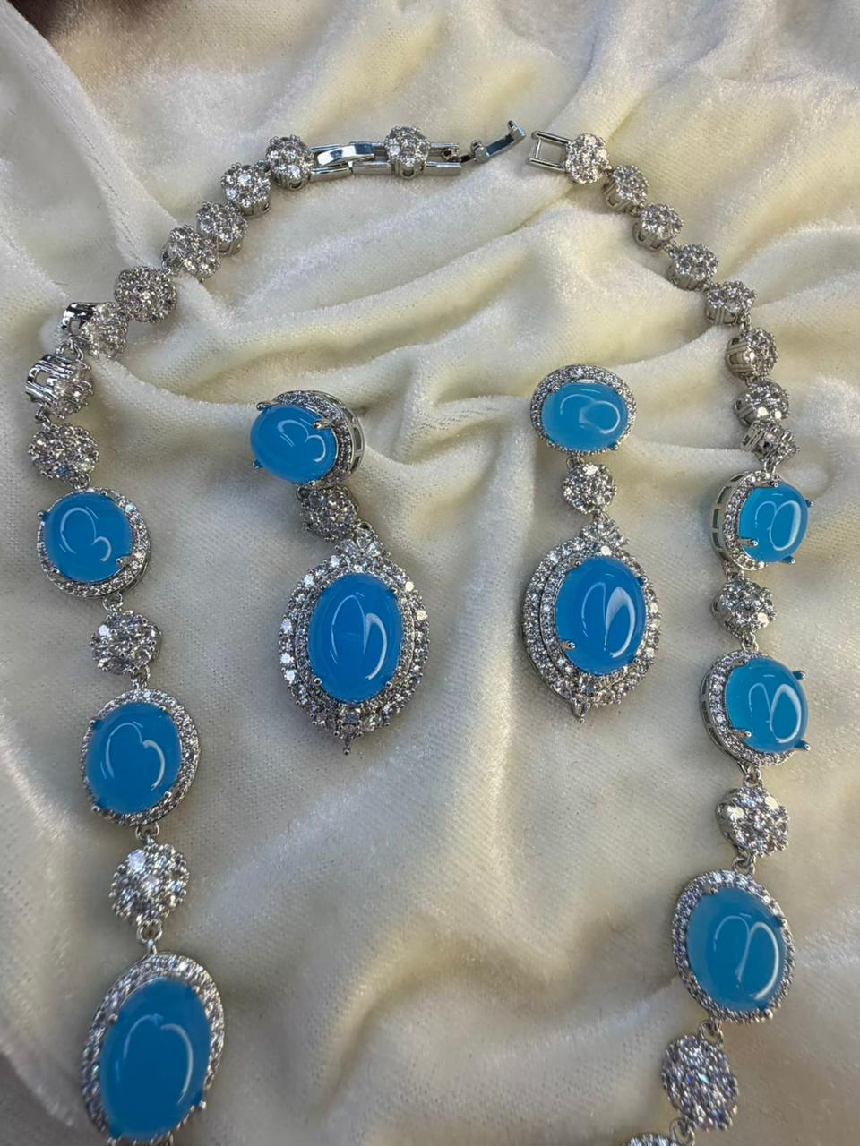 Oval Halo Design Rhodium-Plated Necklace Set with Turquoise Blue Stones