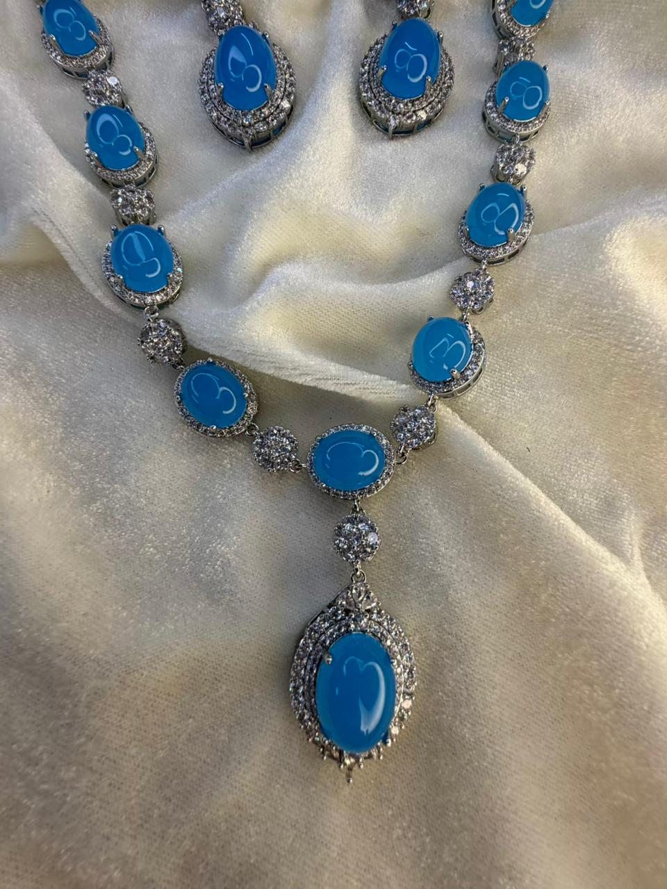 Oval Halo Design Rhodium-Plated Necklace Set with Turquoise Blue Stones