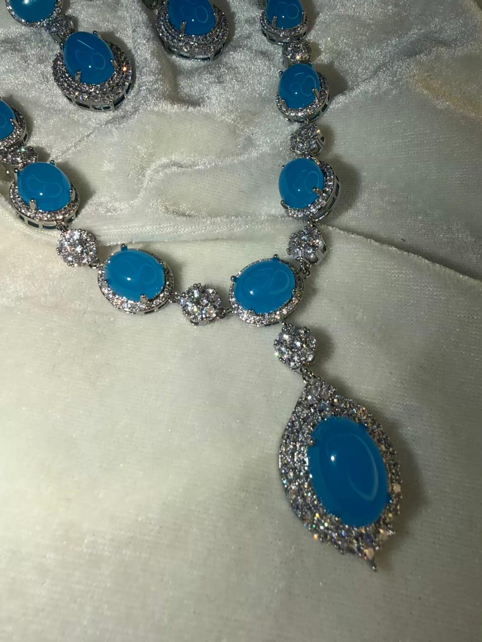 Oval Halo Design Rhodium-Plated Necklace Set with Turquoise Blue Stones