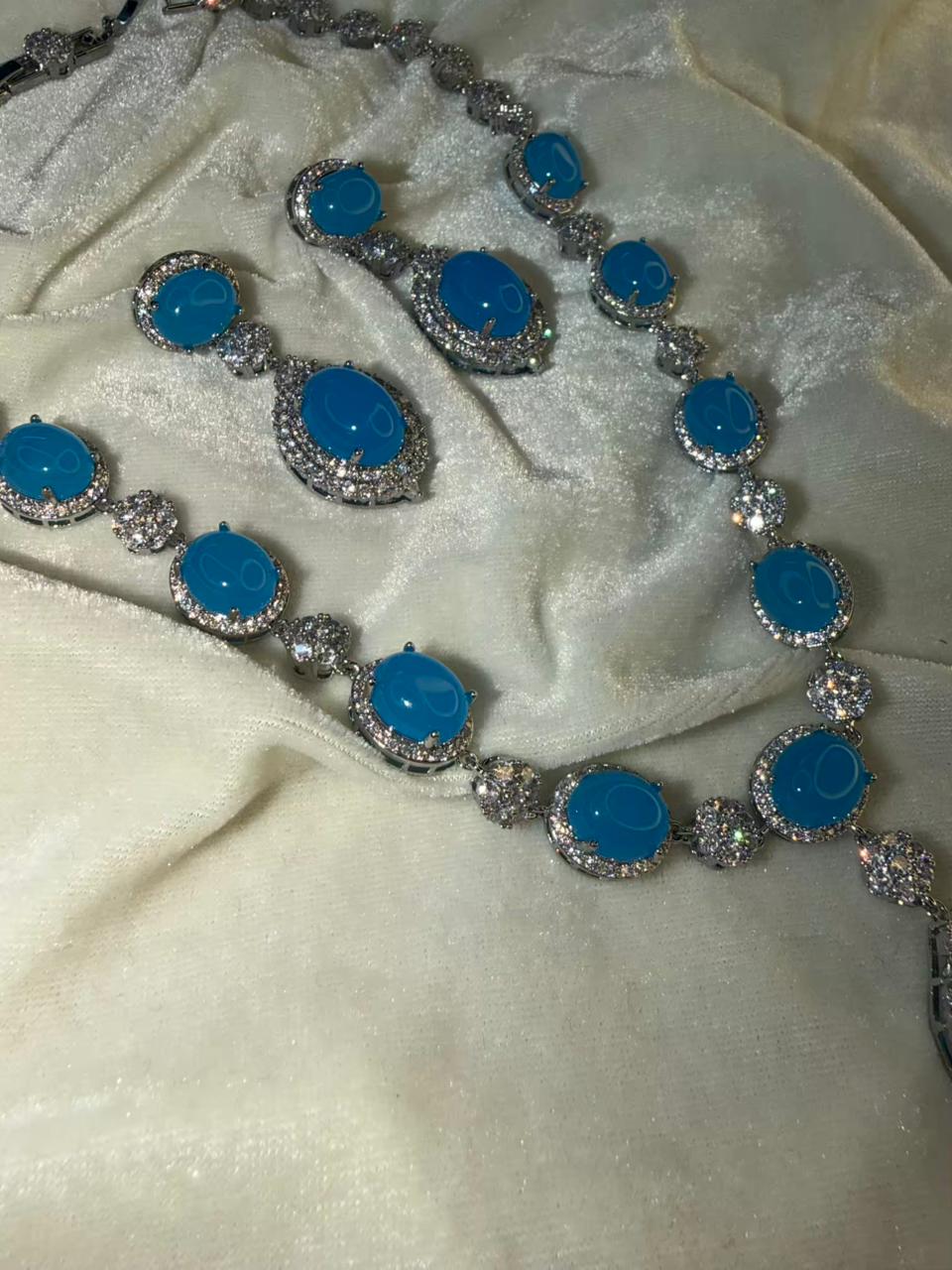 Oval Halo Design Rhodium-Plated Necklace Set with Turquoise Blue Stones