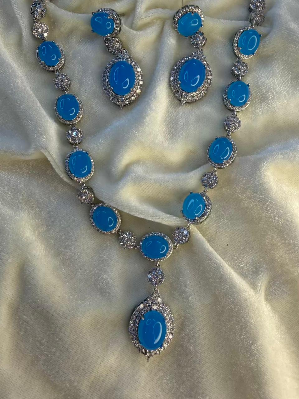 Oval Halo Design Rhodium-Plated Necklace Set with Turquoise Blue Stones