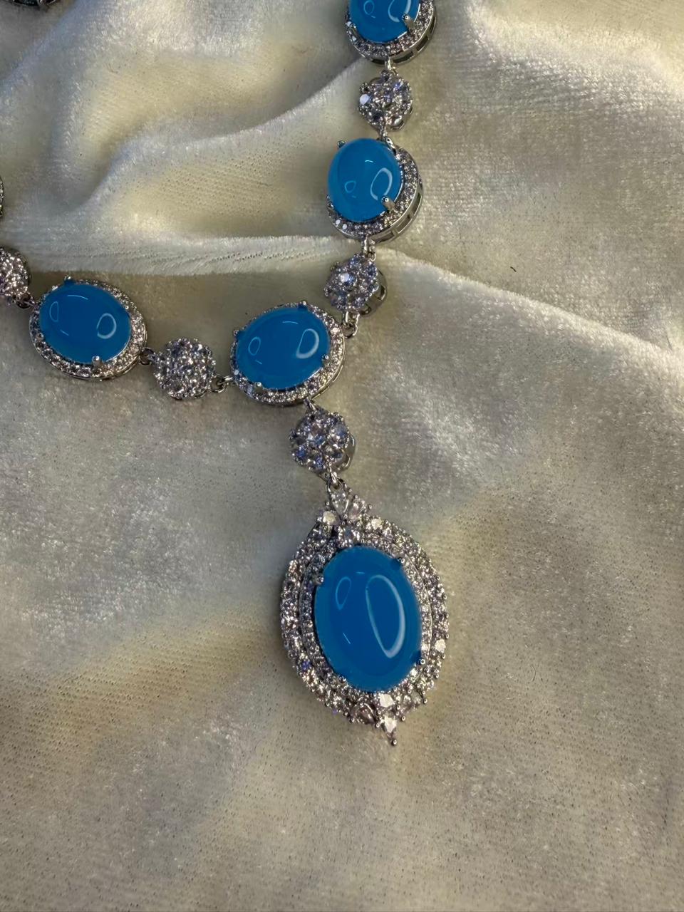 Oval Halo Design Rhodium-Plated Necklace Set with Turquoise Blue Stones
