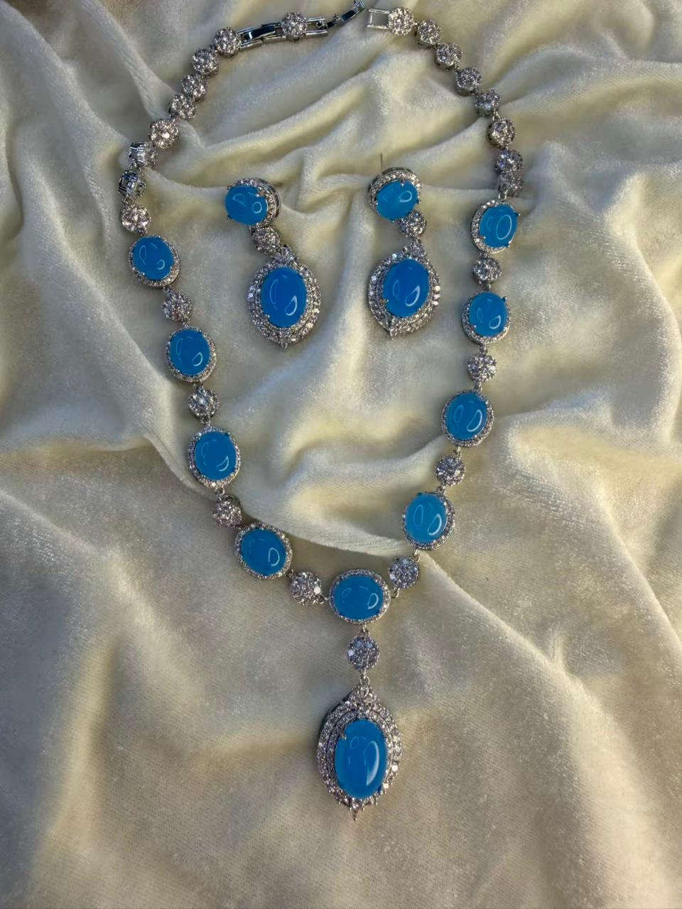 Oval Halo Design Rhodium-Plated Necklace Set with Turquoise Blue Stones