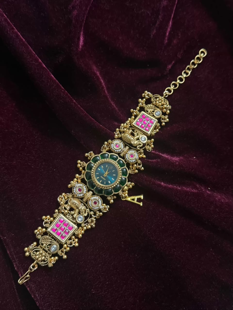 Maharaja Emerald Round Dial Designer Watch Rakhi in Premium Swarovski (Free Initial)