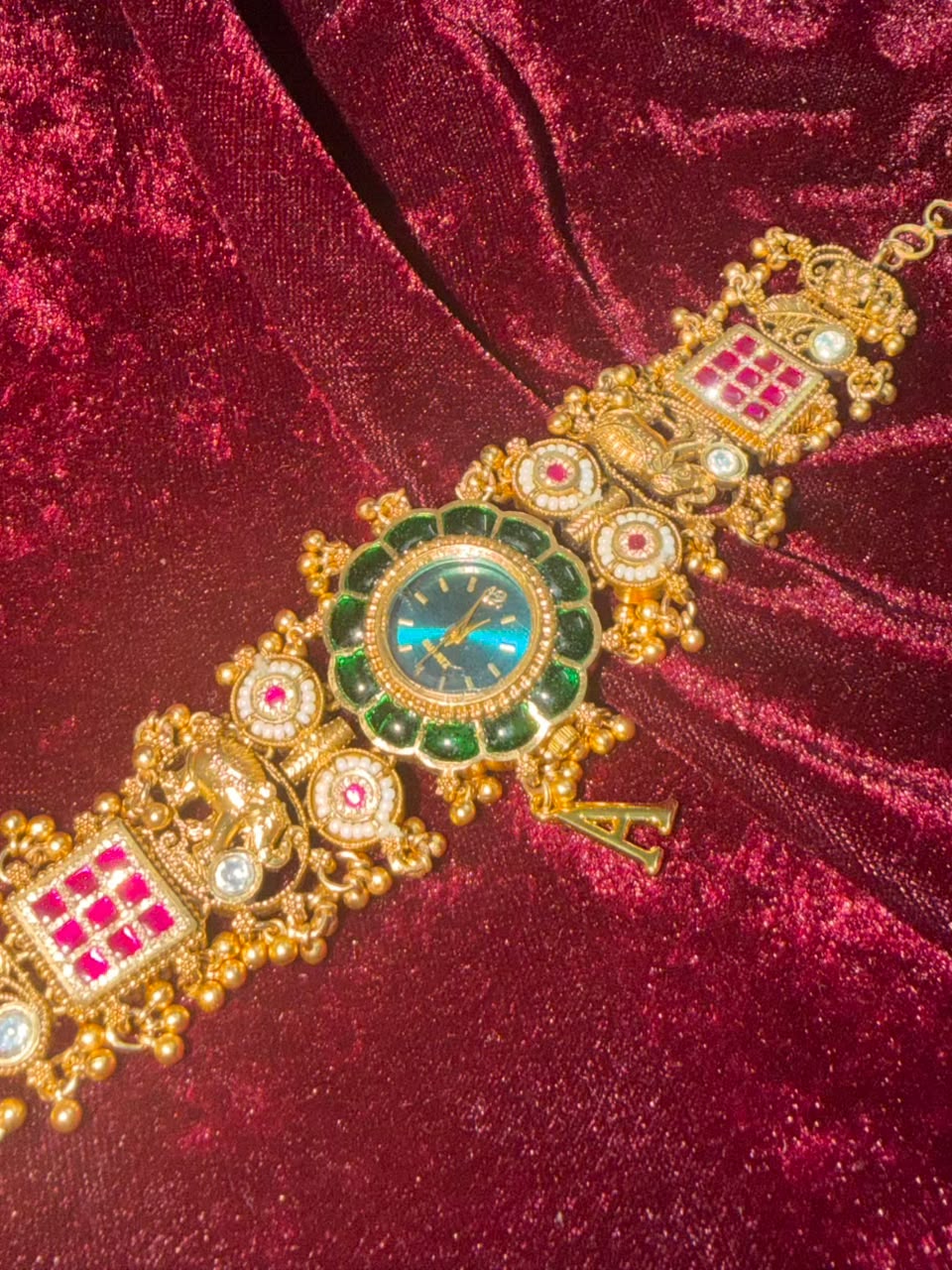 Maharaja Emerald Round Dial Designer Watch Rakhi in Premium Swarovski (Free Initial)
