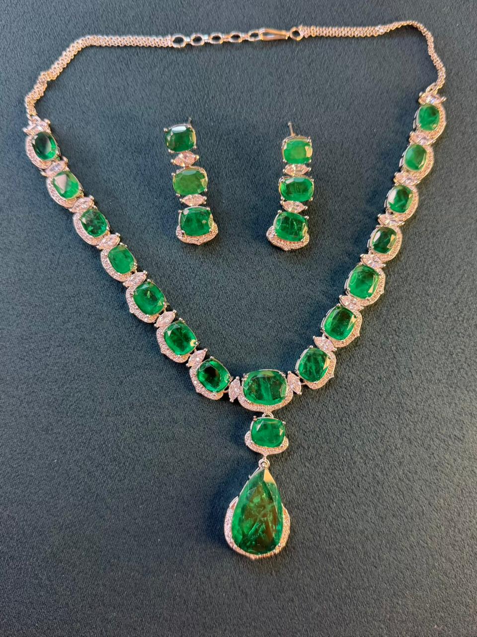 Emerald Green Luxury Studded Necklace and Studs Sets in Rhodium Gold Plating