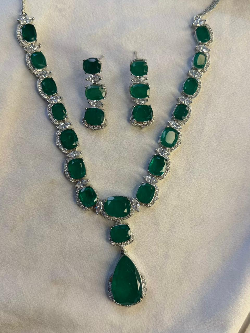 Emerald Green Luxury Studded Necklace and Studs Sets in Rhodium Gold Plating
