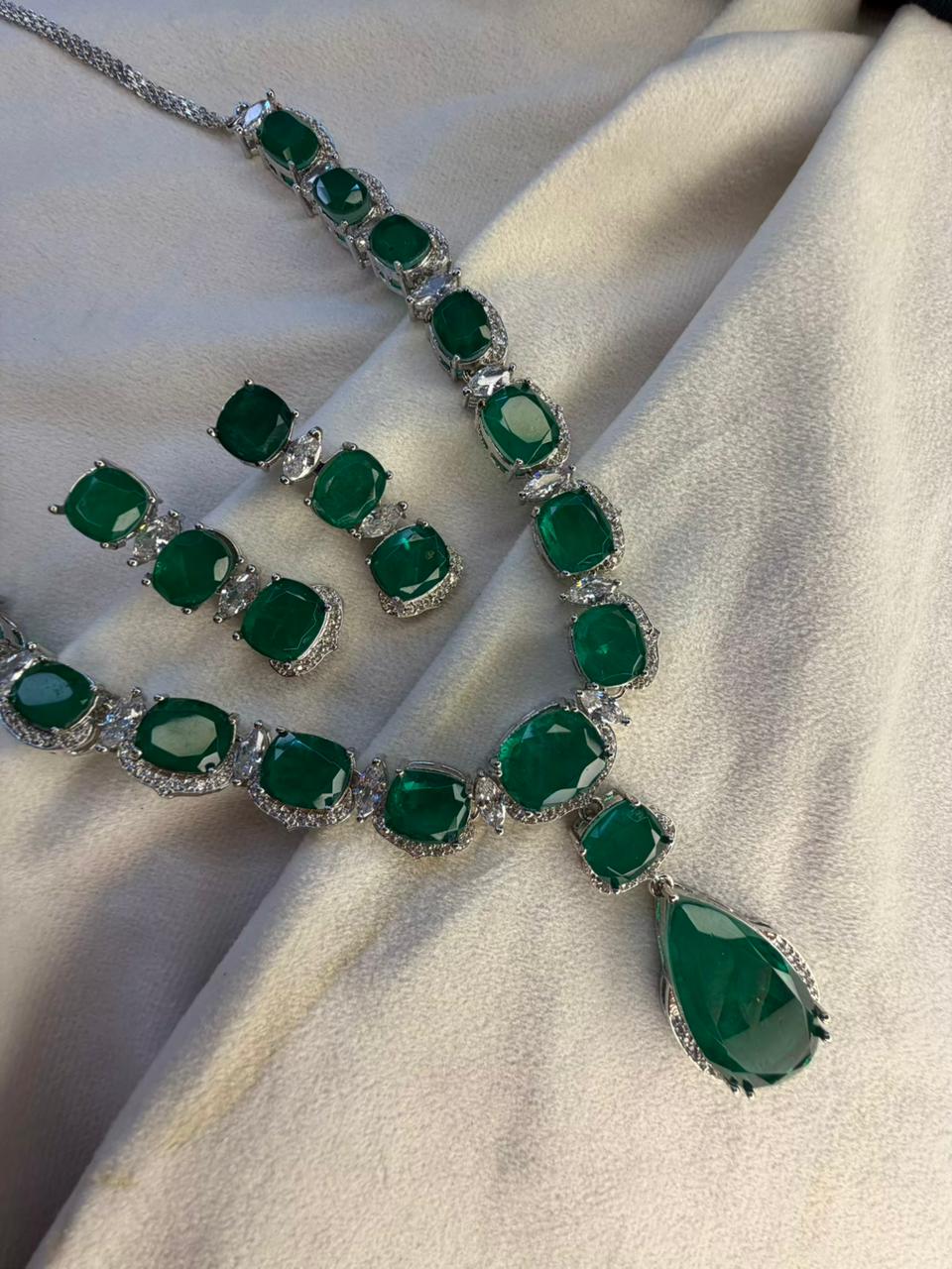Emerald Green Luxury Studded Necklace and Studs Sets in Rhodium Gold Plating