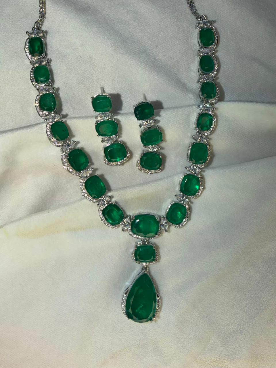Emerald Green Luxury Studded Necklace and Studs Sets in Rhodium Gold Plating