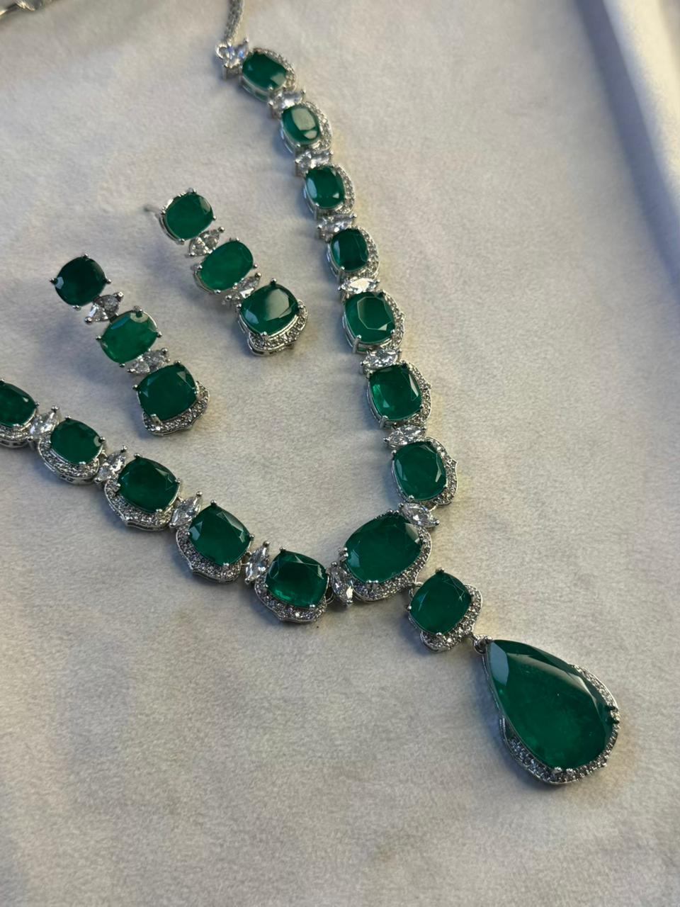 Emerald Green Luxury Studded Necklace and Studs Sets in Rhodium Gold Plating