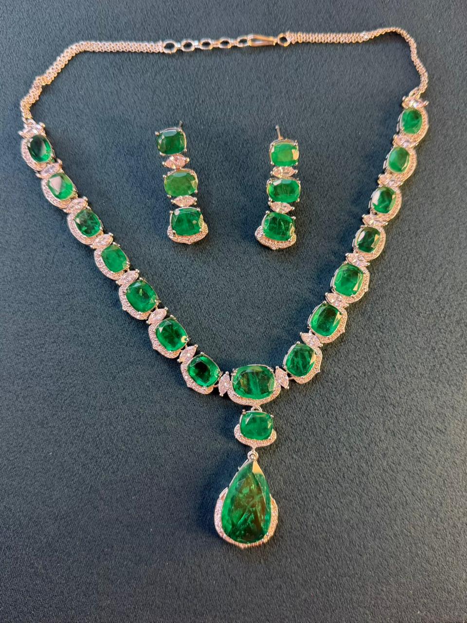 Emerald Green Luxury Studded Necklace and Studs Sets in Rhodium Gold Plating