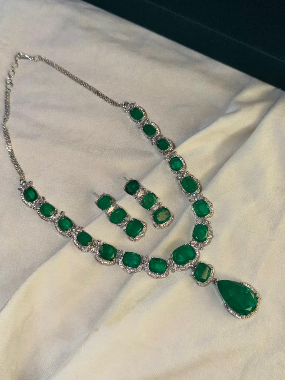 Emerald Green Luxury Studded Necklace and Studs Sets in Rhodium Gold Plating