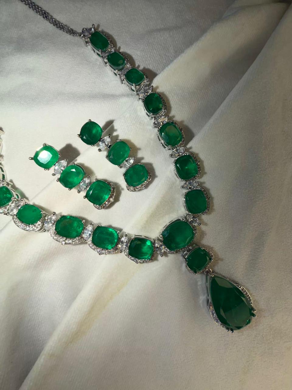 Emerald Green Luxury Studded Necklace and Studs Sets in Rhodium Gold Plating