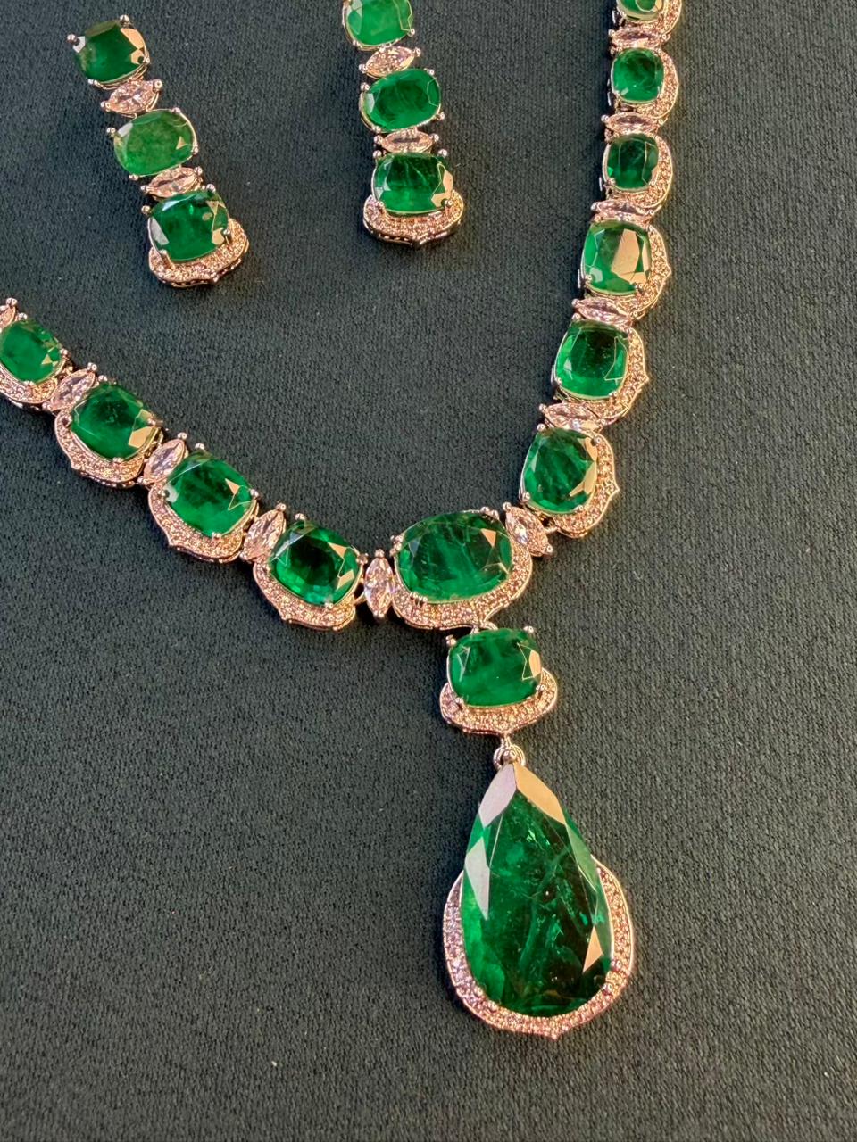 Emerald Green Luxury Studded Necklace and Studs Sets in Rhodium Gold Plating