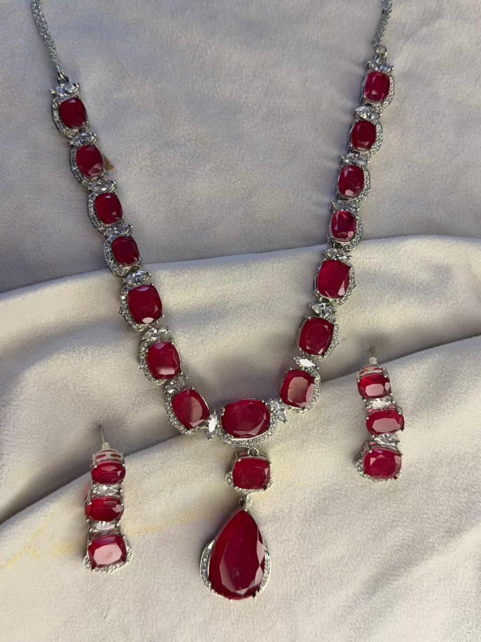 Ruby Red Luxury Studded Necklace and Studs Sets in Rhodium Silver Plating