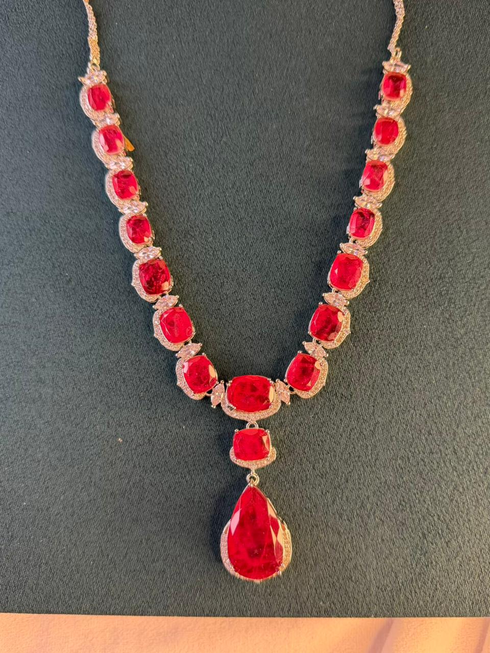 Ruby Red Luxury Studded Necklace and Studs Sets in Rhodium Silver Plating
