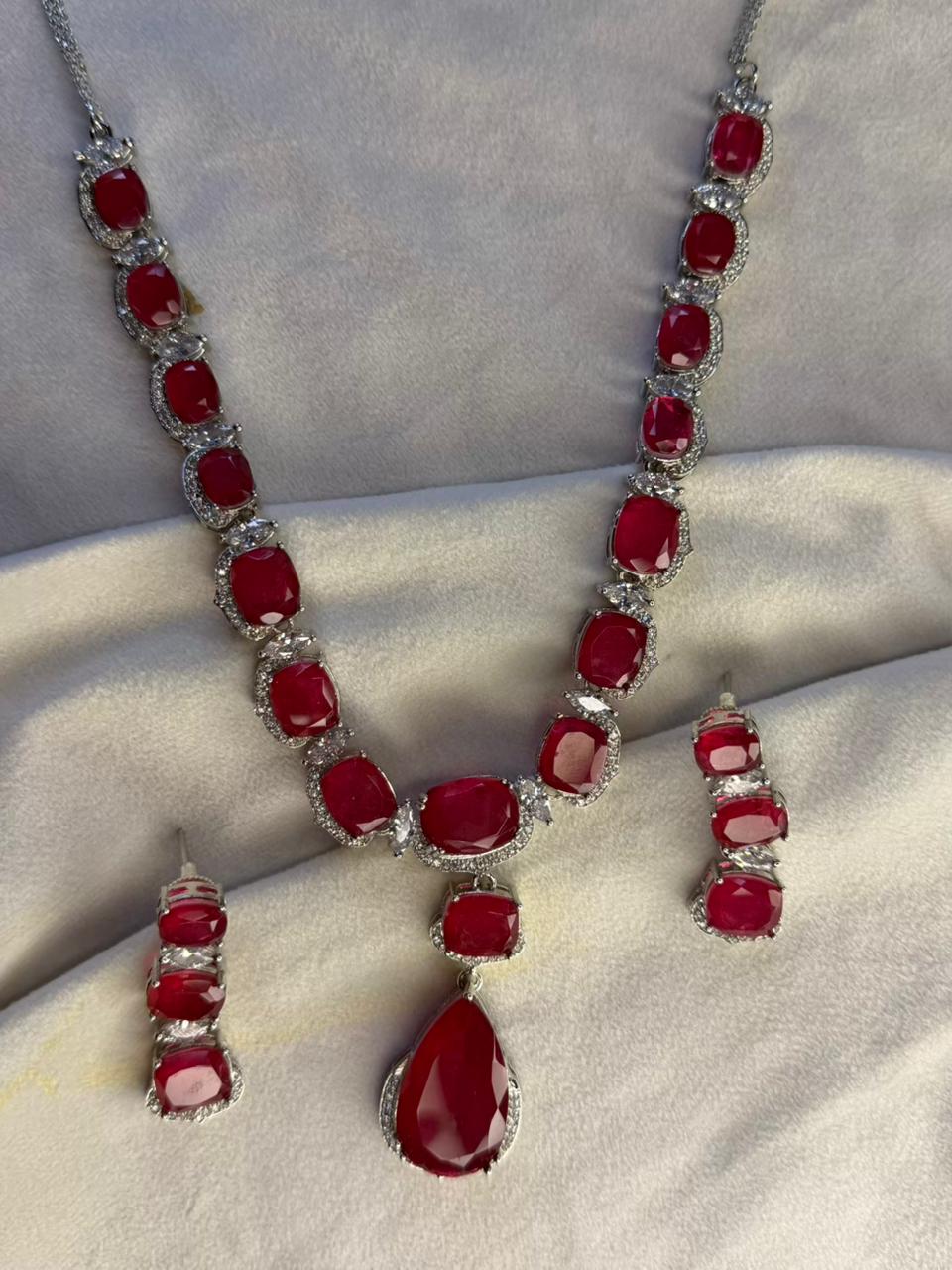 Ruby Red Luxury Studded Necklace and Studs Sets in Rhodium Silver Plating