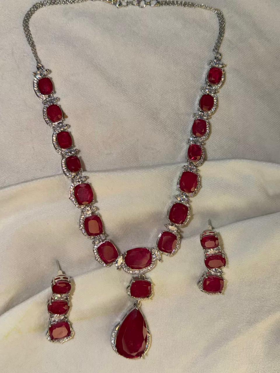 Ruby Red Luxury Studded Necklace and Studs Sets in Rhodium Silver Plating