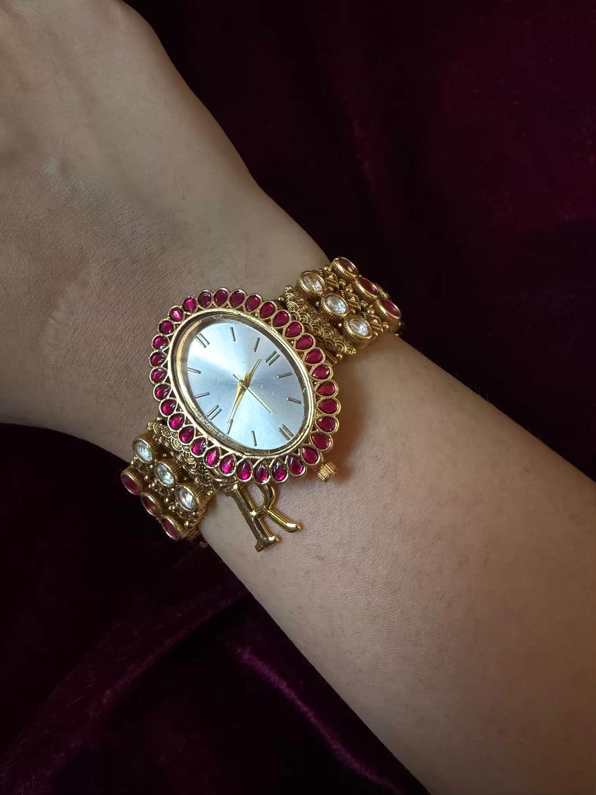Oval Dial Maharani Bracelet Watch Rakhi in Premium Swarovski – Gold & Ruby Pink