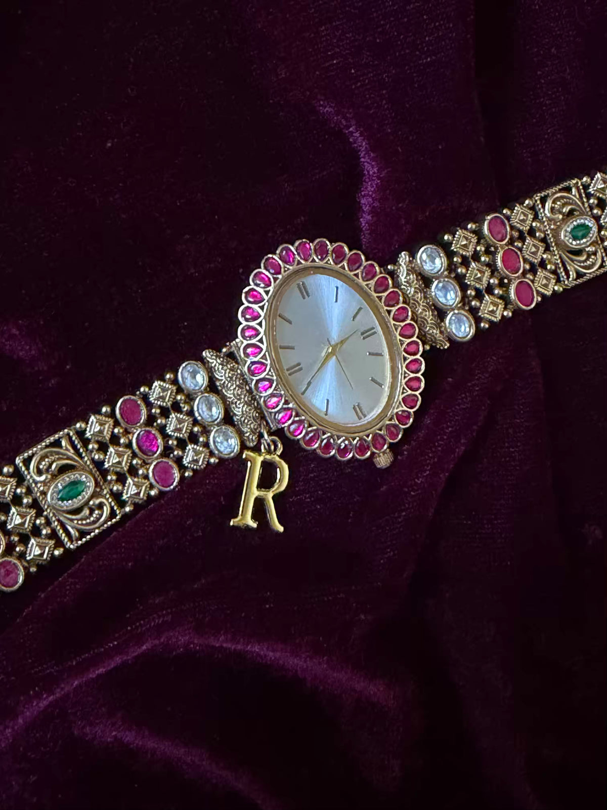 Oval Dial Maharani Bracelet Watch Rakhi in Premium Swarovski – Gold & Ruby Pink