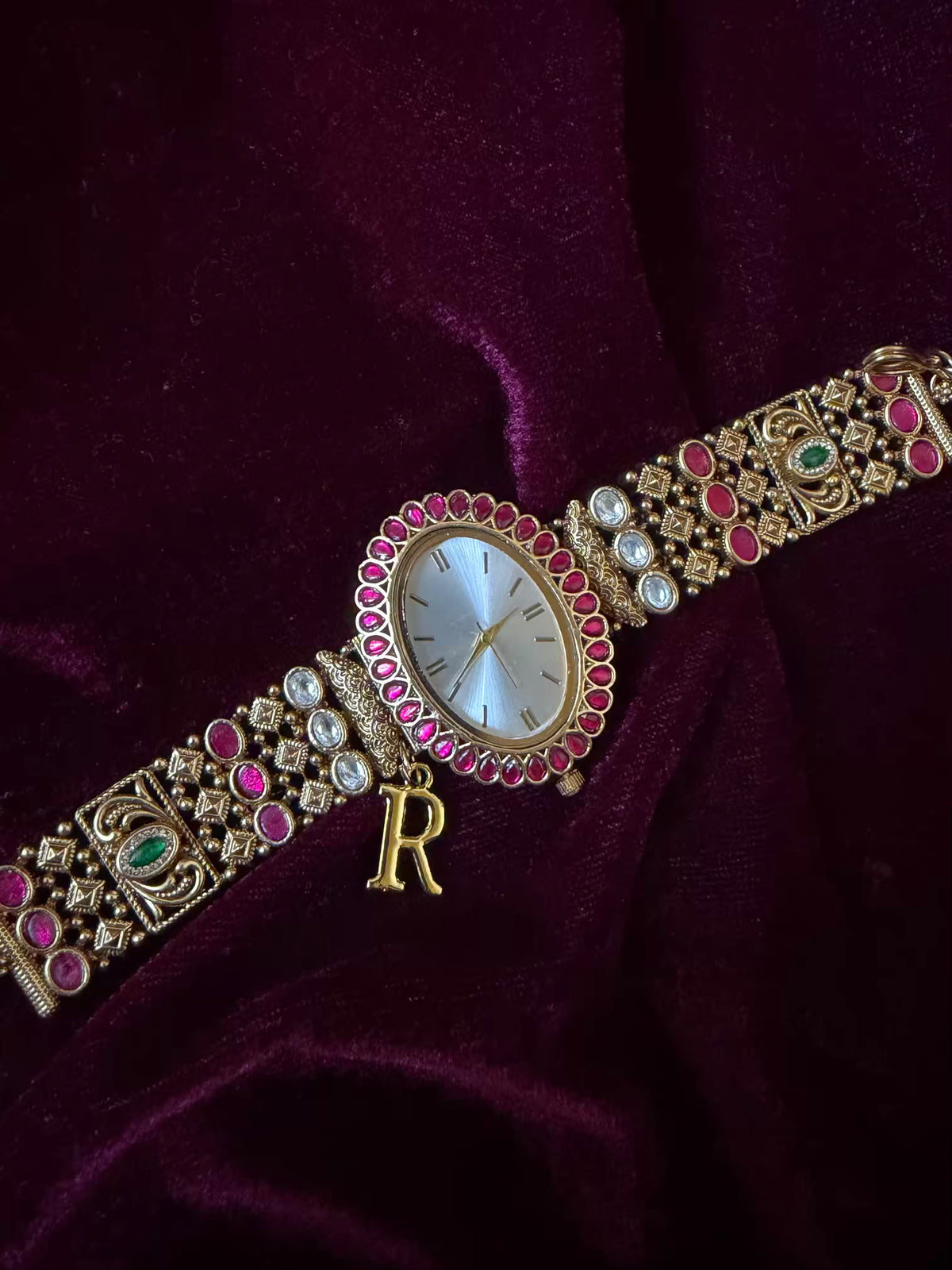 Oval Dial Maharani Bracelet Watch Rakhi in Premium Swarovski – Gold & Ruby Pink