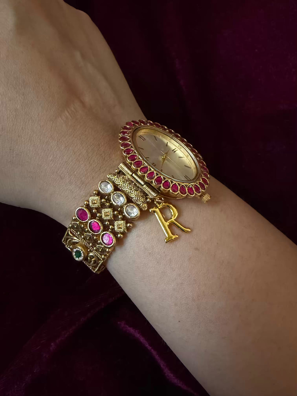 Oval Dial Maharani Bracelet Watch Rakhi in Premium Swarovski – Gold & Ruby Pink