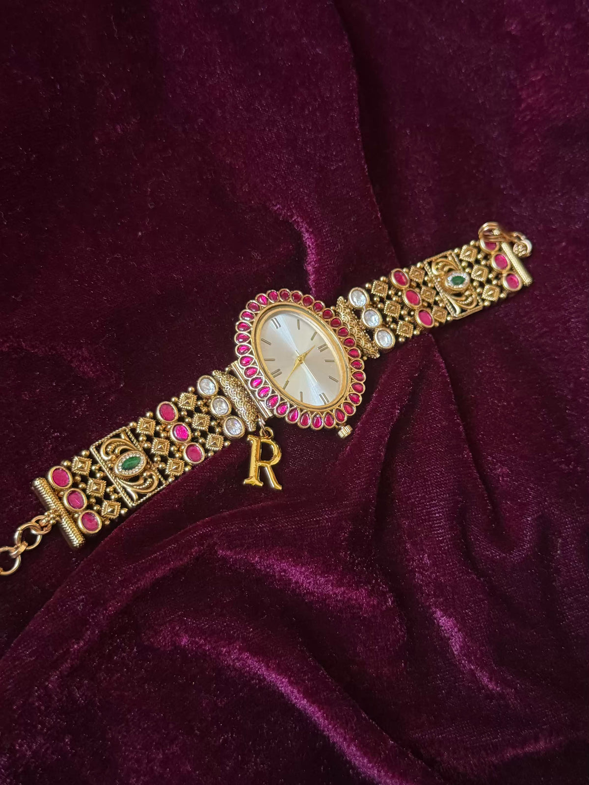 Oval Dial Maharani Bracelet Watch Rakhi in Premium Swarovski – Gold & Ruby Pink