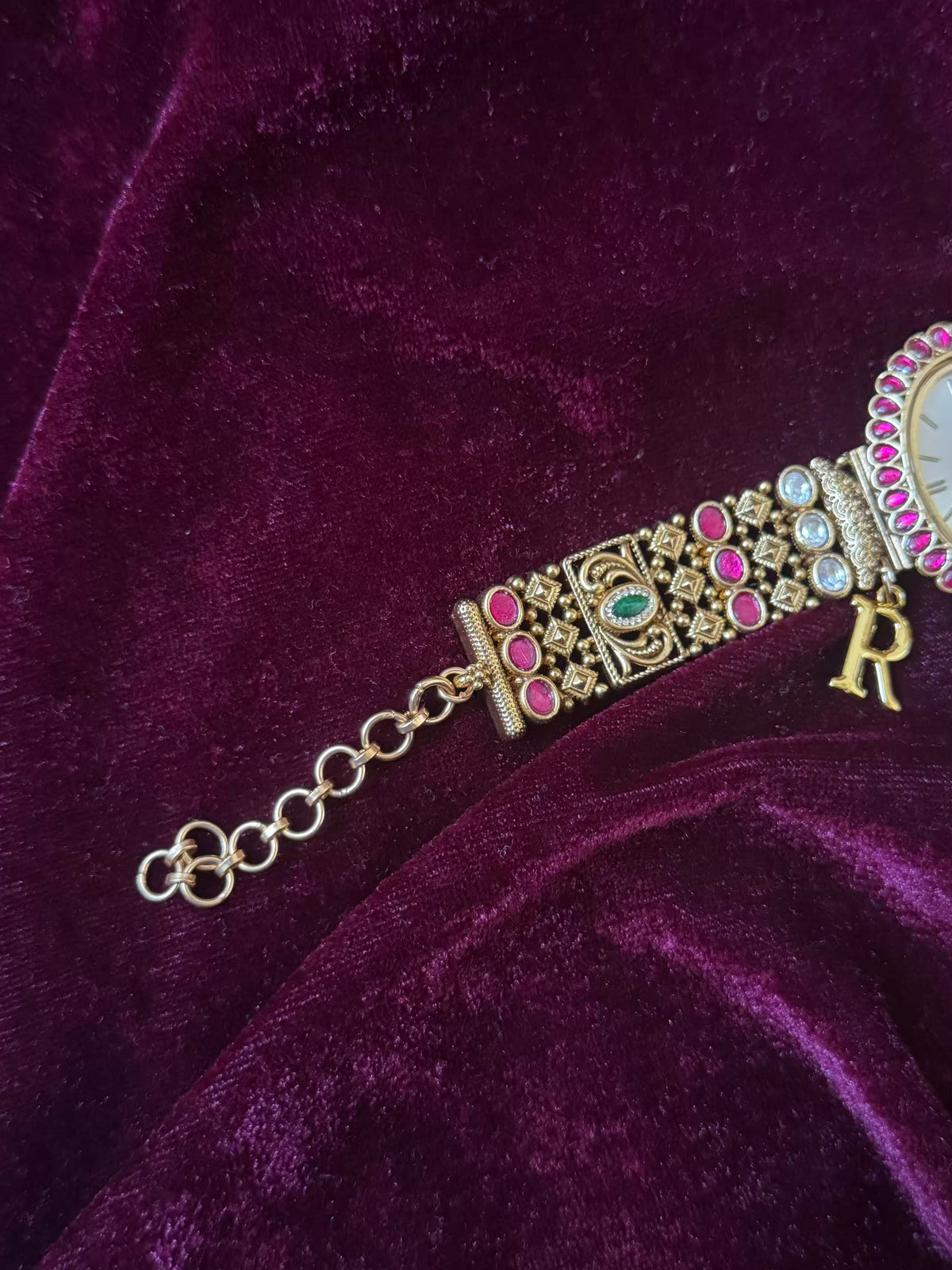 Oval Dial Maharani Bracelet Watch Rakhi in Premium Swarovski – Gold & Ruby Pink