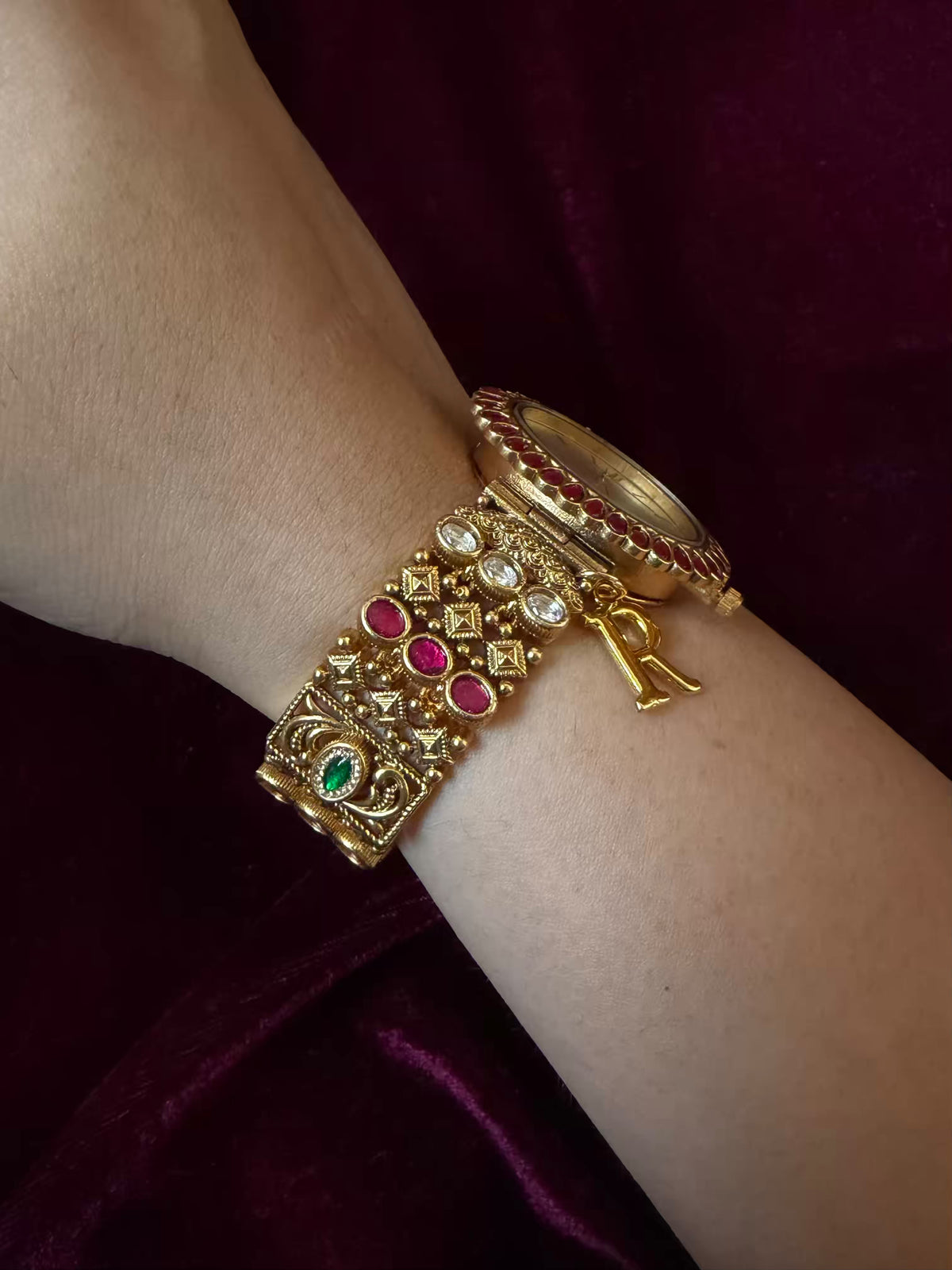 Oval Dial Maharani Bracelet Watch Rakhi in Premium Swarovski – Gold & Ruby Pink