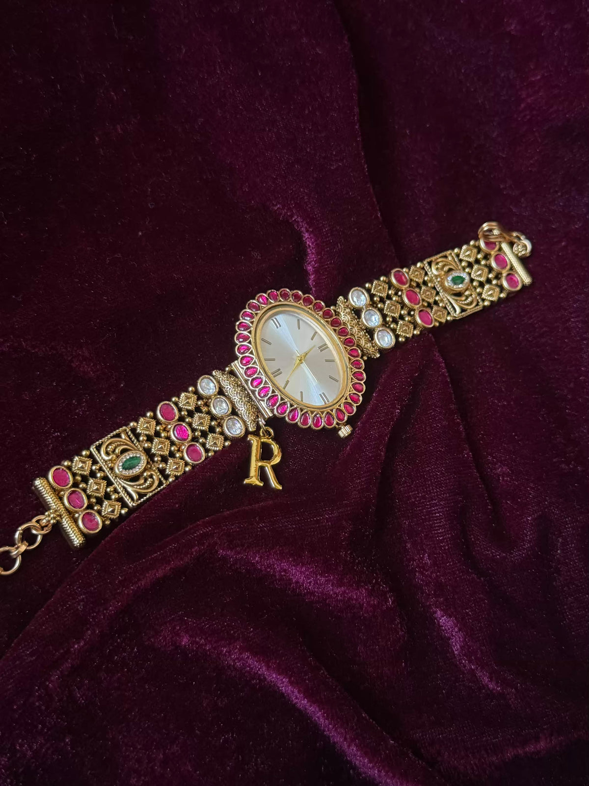 Oval Dial Maharani Bracelet Watch Rakhi in Premium Swarovski – Gold & Ruby Pink